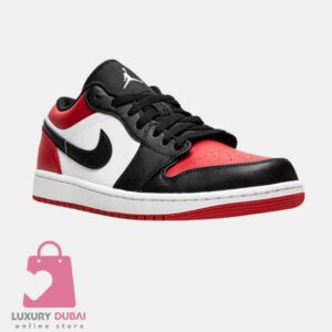 Experience the timeless elegance of the New Air Jordan 1 Low Bred Toe - Luxuary Dubai, featuring a sleek black, white, and red colorway