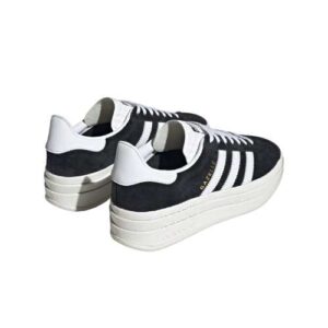 Step up your style with the sleek and timeless Adidas Originals sneakers in black and white. Perfect for any occasion