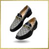 Elevate your style with these sleek black leather slip-on shoes featuring a luxurious gold buckle. Perfect for the modern gentleman