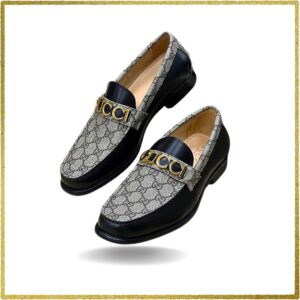 Elevate your style with these sleek black leather slip-on shoes featuring a luxurious gold buckle. Perfect for the modern gentleman