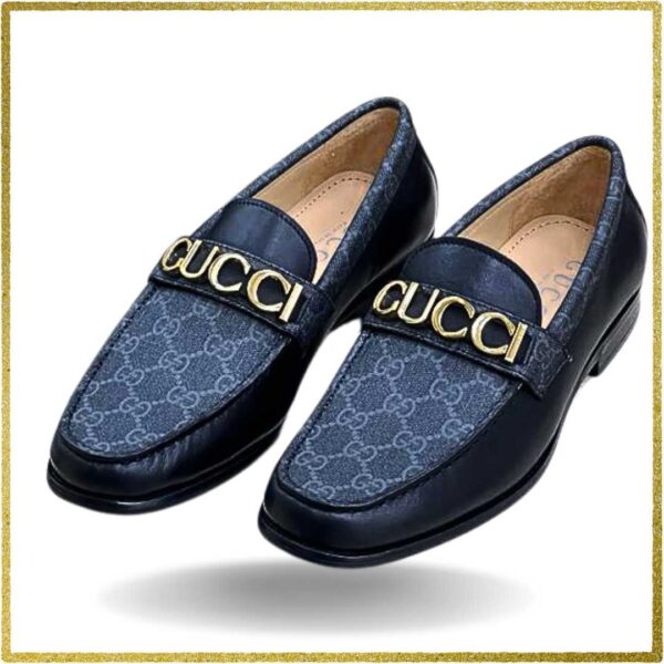 Indulge in the epitome of luxury with these men's black leather slip-on shoes. The gold buckle adds a touch of opulence, making them a must-have for any stylish man