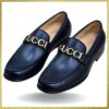 Step into sophistication with these exclusive Gucci men's loafers. Crafted from black leather and adorned with a gold buckle, they exude luxury and elegance