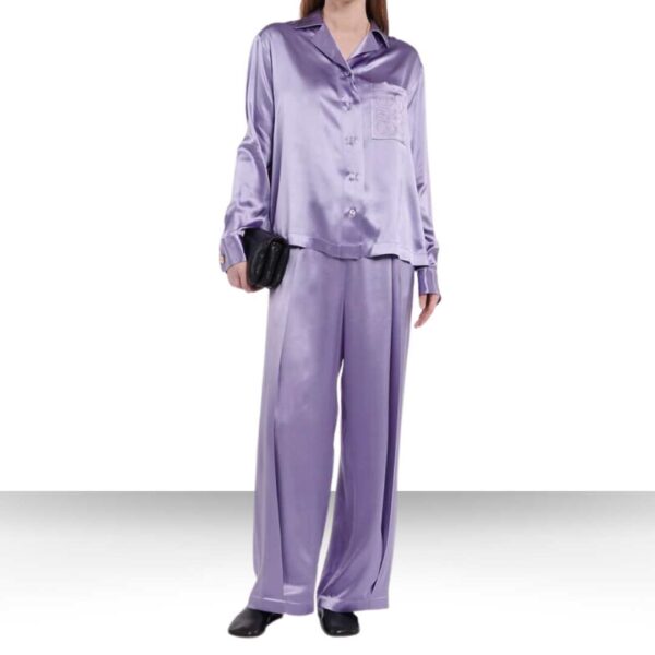 Experience the epitome of luxury with the opulent Luxury Loewe Anagram Silk Pajama Set - a stylish purple set featuring a coordinated shirt and pants
