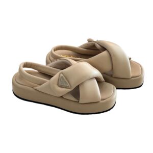 Elevate your style with Luxury Prada Triangle Logo Padded Sandals - Luxuary Dubai. Step out in chic sandals with a cross design on the sole